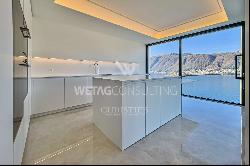 For sale in Lugano-Bissone elegant apartment with terrace & magic lake view