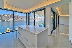 For sale in Lugano-Bissone elegant apartment with terrace & magic lake view