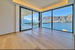 For sale in Lugano-Bissone elegant apartment with terrace & magic lake view