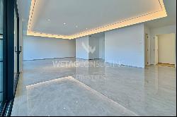 For sale in Lugano-Bissone elegant apartment with terrace & magic lake view