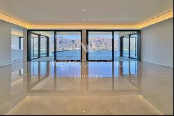 For sale in Lugano-Bissone elegant apartment with terrace & magic lake view