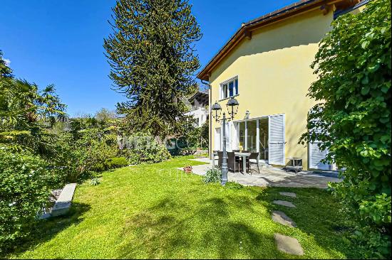 For sale in Lugano-Odogno: a delightful villa featuring an outdoor swimming pool, a detac