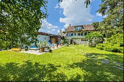 Lugano-Magliaso: charming villa for sale, nestled in lush greenery, featuring a swimming 