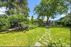 Lugano-Magliaso: charming villa for sale, nestled in lush greenery, featuring a swimming 