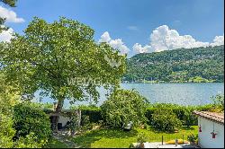 Lugano-Magliaso: charming villa for sale, nestled in lush greenery, featuring a swimming 