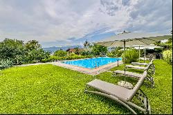 Lugano-Ruvigliana: elegant apartment with breathtaking lake views, pool & garden for sale