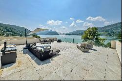 Lugano-Muzzano: charming penthouse apartment for sale, directly by the lake & with roof t