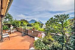 For sale in Lugano-Gentilino: elegant apartment with private garden & partial view of Lak