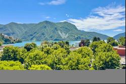 Lugano-Castagnola: elegant penthouse apartment for sale, offering expansive panoramic vie