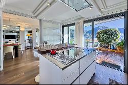 Prestigious duplex apartment in Porza with private garden & wide view of Lake Lugano for 