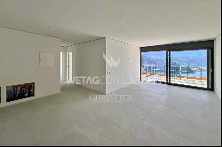 Modern penthouse apartment for sale in Lugano-Carona with breathtaking lake view & roof t