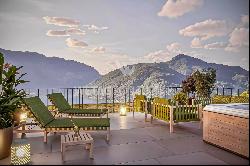 Modern penthouse apartment for sale in Lugano-Carona with breathtaking lake view & roof t