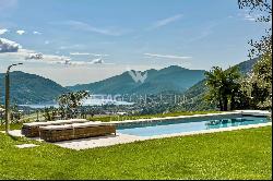 Stunning villa with expansive swimming pool & Lake Lugano views, available for sale in Lu