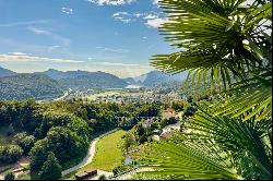 Stunning villa with expansive swimming pool & Lake Lugano views, available for sale in Lu