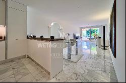 Modern apartment for sale in Ascona with partial view of Lake Maggiore