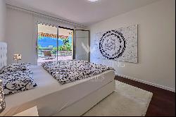 Modern apartment for sale in Ascona with partial view of Lake Maggiore