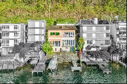 Lugano-Bissone: for sale, villa pieds dans l'eau, featuring a private pier & two addition