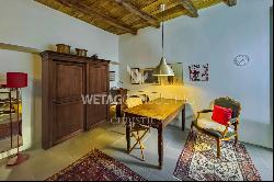 In the heart of Ascona, a modern apartment with a private garden & separate atelier for s