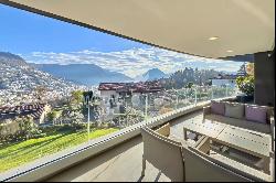 Porza: luxury penthouse apartment with a view of Lake Lugano for sale