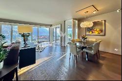 Porza: luxury penthouse apartment with a view of Lake Lugano for sale