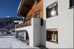 8-room chalet with two flats in an exclusive ski-in/ski-out location.