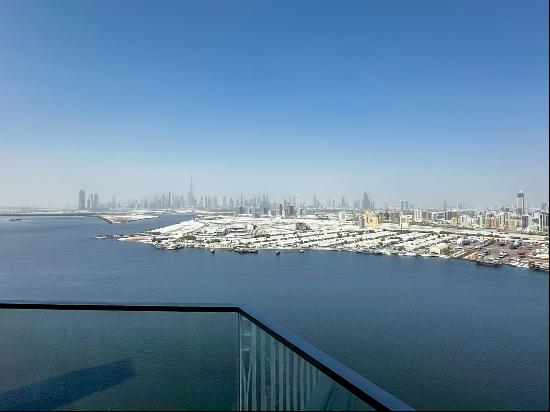 Waterfront Apartment with Creek and Skyline Views