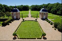 An exceptional listed Louis XIII style chateau set in 40 enclosed hectares with formal Fr