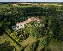 A splendid country estate with guardian cottage spanning over 32 acres with far-reaching 