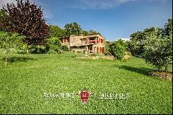 RUSTIC FARMHOUSE WITH SWIMMING POOL AND 58 HA OF WOODS FOR SALE IN TUSCANY