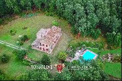 RUSTIC FARMHOUSE WITH SWIMMING POOL AND 58 HA OF WOODS FOR SALE IN TUSCANY