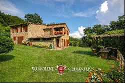 RUSTIC FARMHOUSE WITH SWIMMING POOL AND 58 HA OF WOODS FOR SALE IN TUSCANY