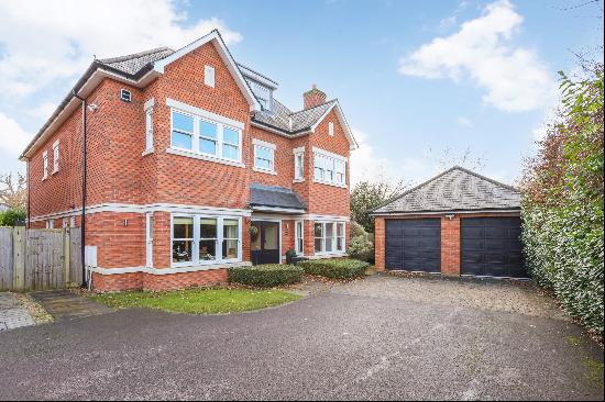 Nestled in the heart of Oxshott village, this exceptional property offers contemporary fam