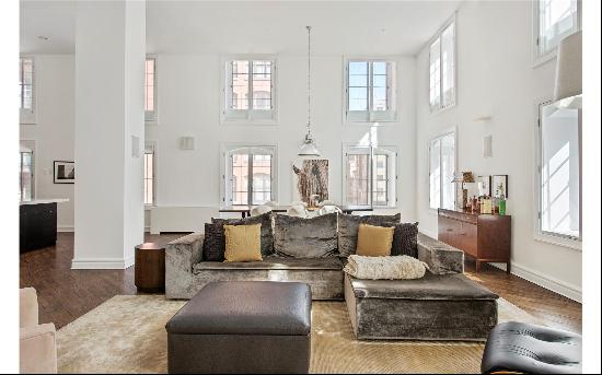 Dramatic corner loft with double height ceilings spanning over 3,400 square feet in a f