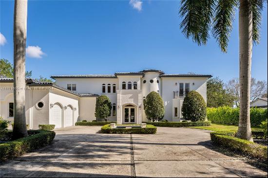 This impeccably renovated Mediterranean estate blends timeless elegance with modern luxury