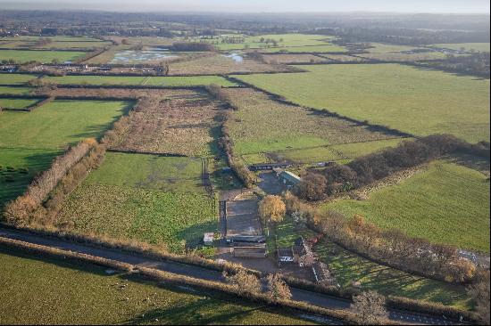 Family home set in excess of 24.5 acres with equestrian facilities for sale in Winkfield.