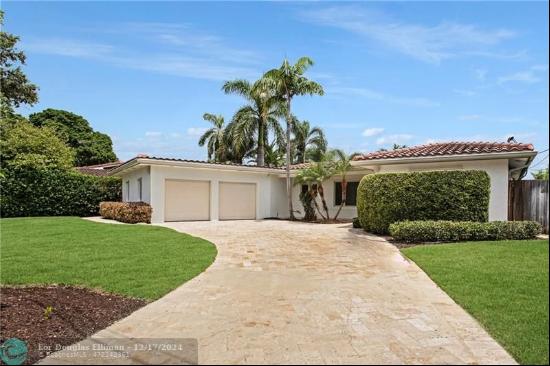 This stunning 3-bedroom, 2-bathroom Coral Ridge home offers 400-ft water views on Seminole