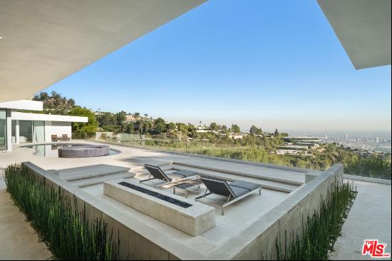 Located on the hillside of Trousdale Estates, this Carla Ridge home boasts an unobstructed