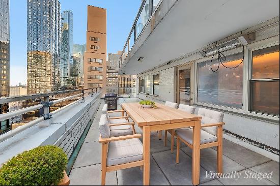 12B at The Continental Condominium is a stunning south and east-facing 2-bedroom, 2-bat