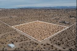 10.81-Acre Corner Parcel with Approved Plans for a Modern Desert Retreat