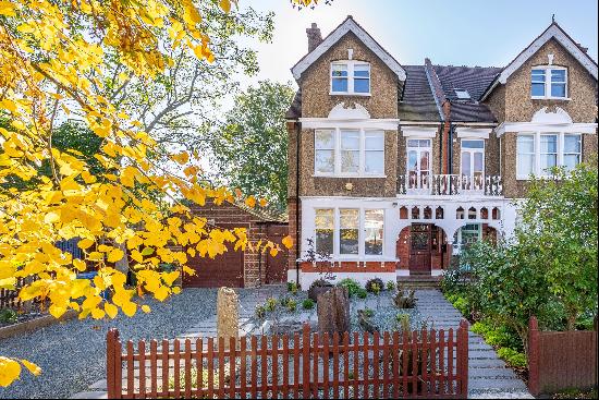 A spacious 5 bedroom, semi-detached family home with a large South West facing garden with