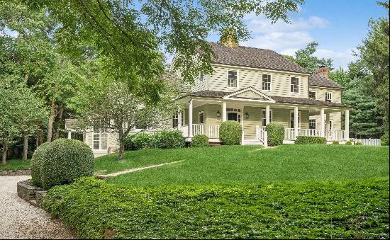 Welcome to 2766 Noyack Road, a custom-built gem nestled on a private road in the heart of 