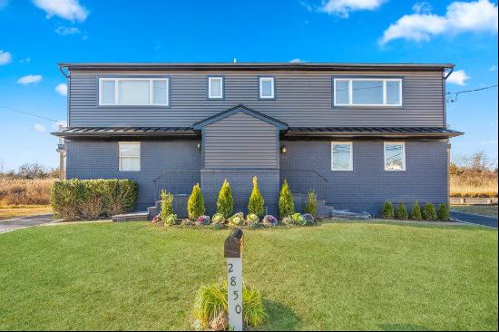 Welcome to this unique waterfront duplex style legal two-family home in South Seaford. The