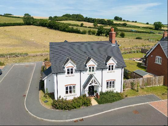 A beautifully presented, handsome modern five bedroom village house.