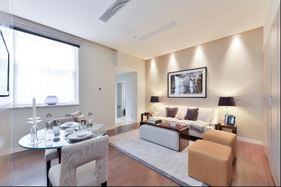 An attractive lower ground floor studio apartment in The Lancasters, W2.