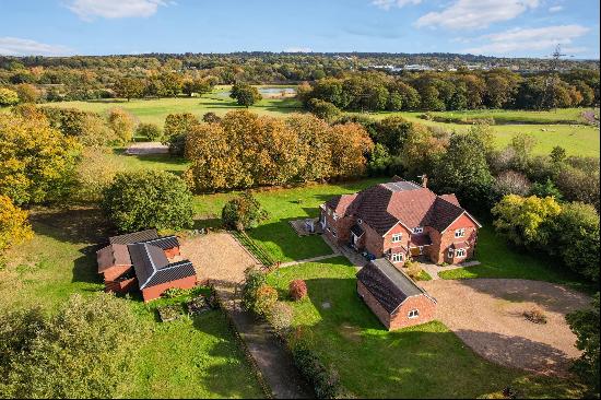 A six bedroom detached home with equestrian facilities sitting in just under 3 Acres.