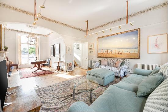 An elegant Victorian house with communal garden access in Holland Park, W11.