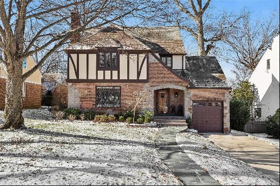 Welcome to this charming Tudor located on a quiet tree-lined street in the heart of Great 