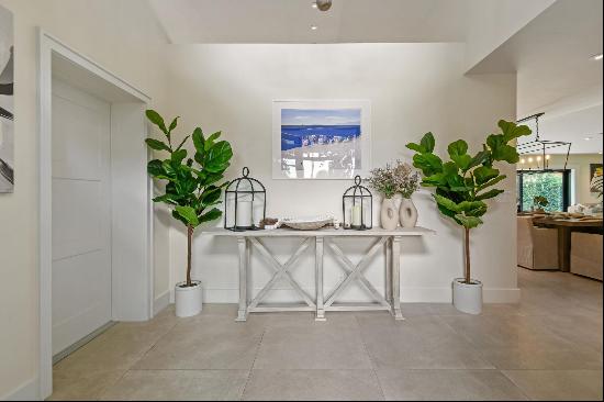 Welcome to your dream home, just steps from the beach in beautiful Jupiter Inlet Colony. T