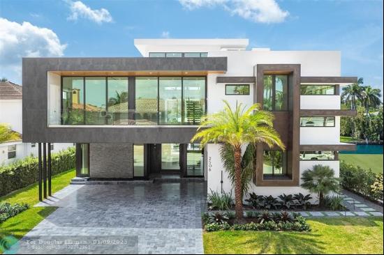 Indulge in luxury waterfront living with this brand-new 6,200 sq. ft. modern masterpiece l