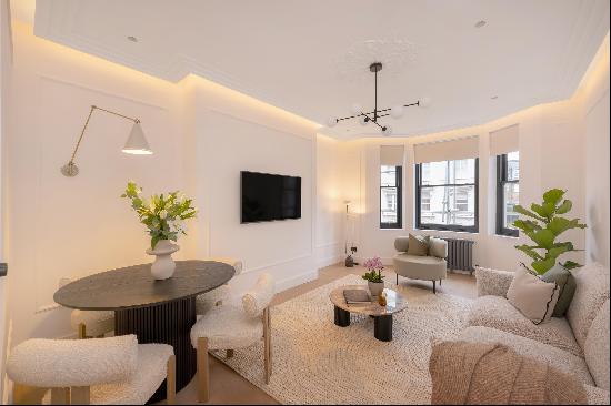 A beautifully redesigned apartment on the second floor of a sought-after red brick mansion